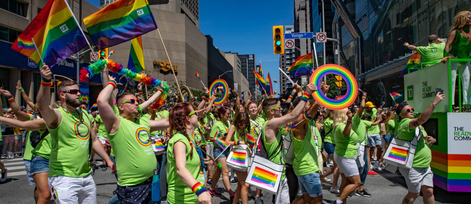Members of TD Canada Trust walking through the parade