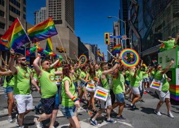 Members of TD Canada Trust walking through the parade