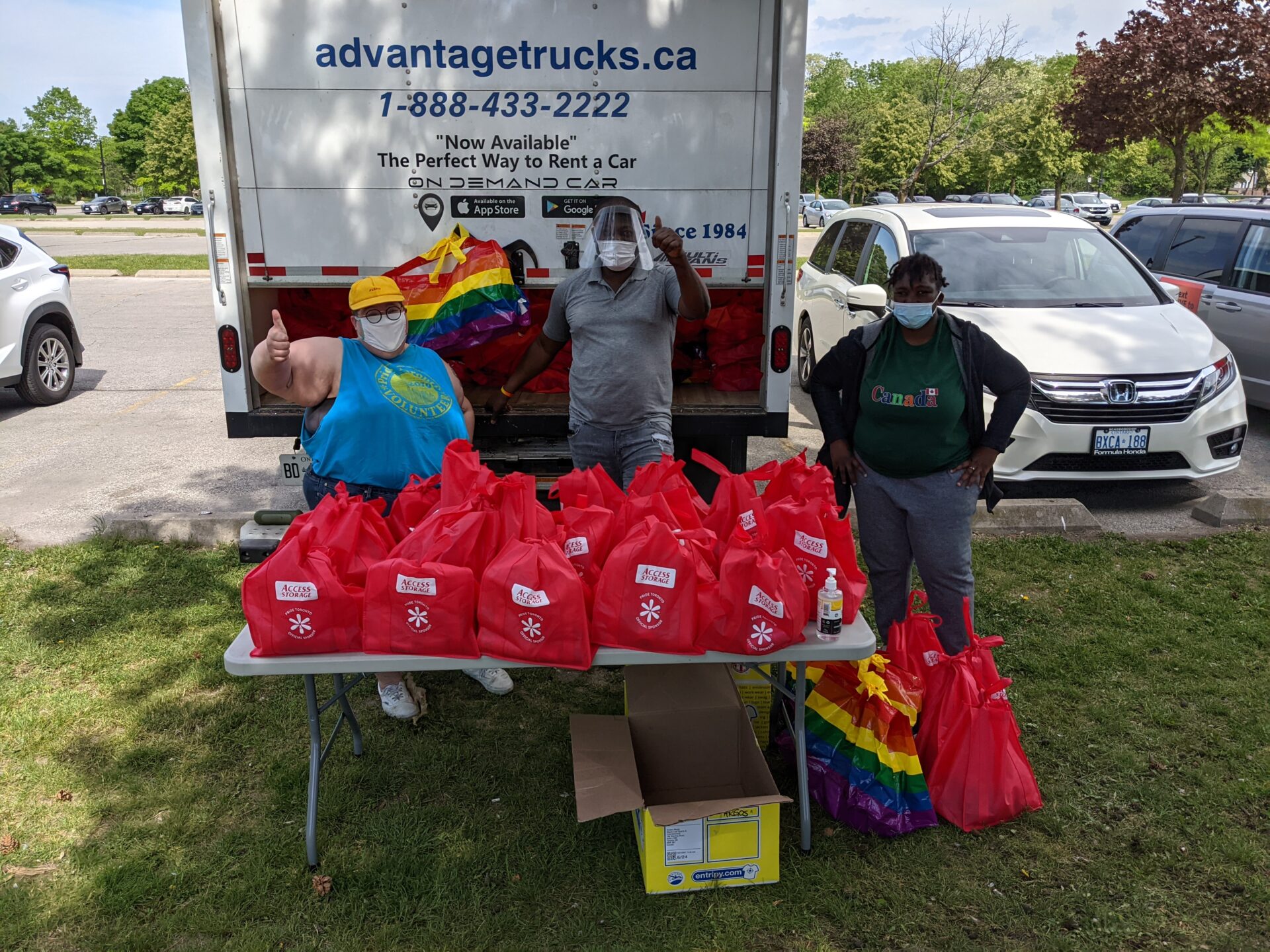 A staff member, Sherwin Modeste and an Volunteer