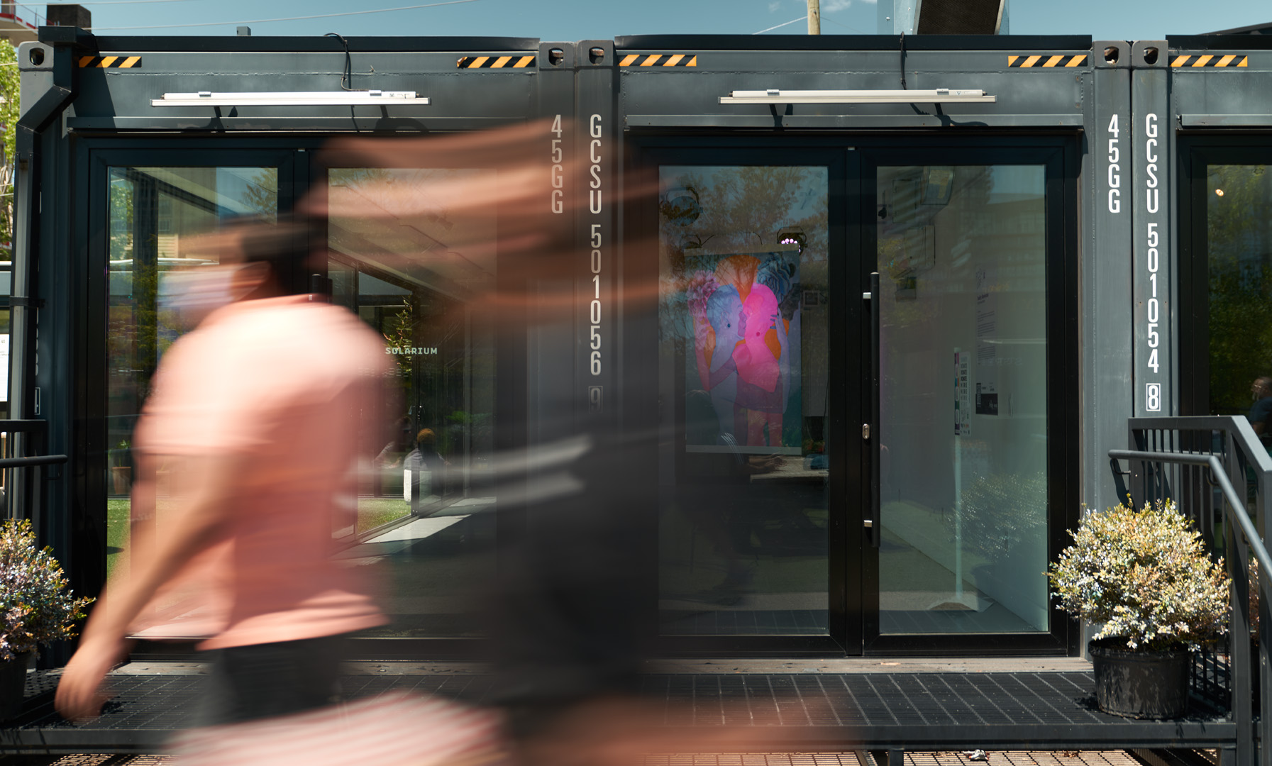 a view of the artwork from the outside of the gallery